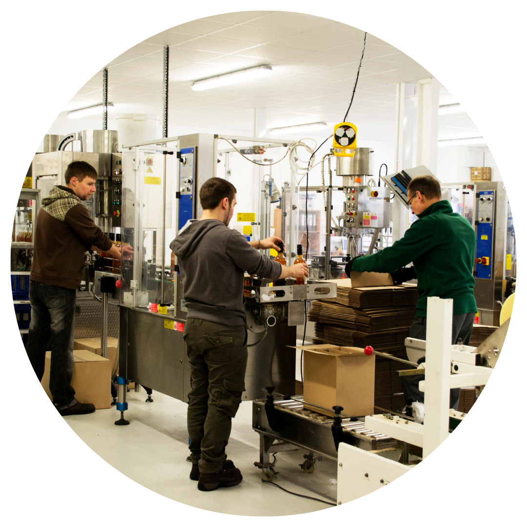 people working in a manufacturing facility