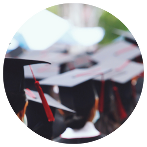 students in caps and gowns at graduation