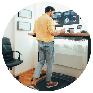 person working on computer at standing desk 