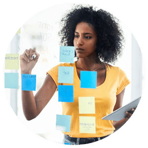 person writing on sticky notes