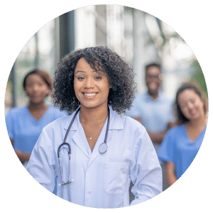 doctor standing with other medical professionals in background