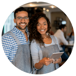 business owners wearing aprons and holding tablet